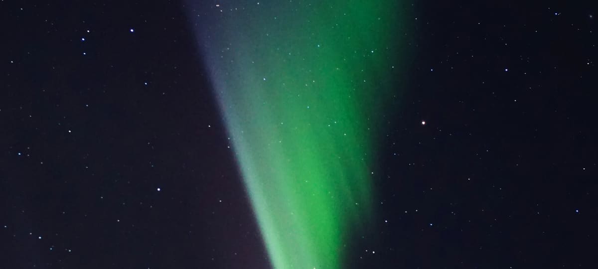 Green aurora in a night sky